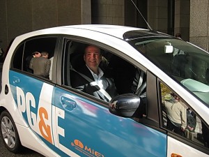 Brad Whitcomb drives away in the Mitsubishi i MiEV