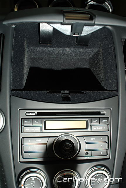 storage compartment takes over space saved for Nissan navigation system