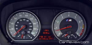 M-design instrument cluster with white backlit instrument dials and red needles